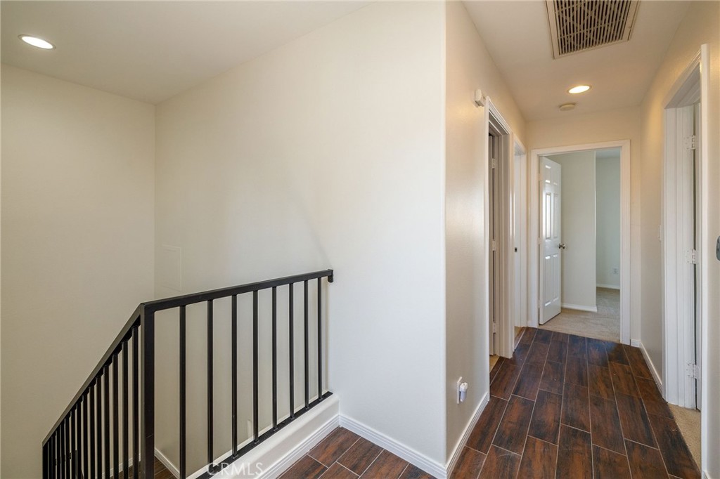 1128 Pacific Avenue Long Beach, CA 90813 - Photo 19 of 33 a view of a hallway with wooden floor and a bathroom