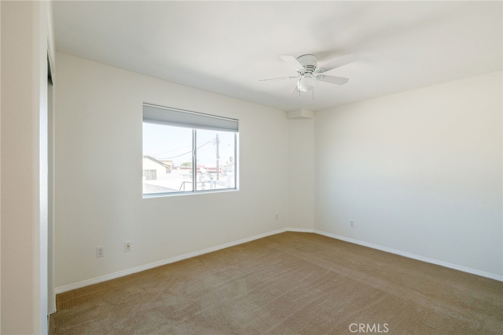 1128 Pacific Avenue Long Beach, CA 90813 - Photo 22 of 33 an empty room with a window and a fan