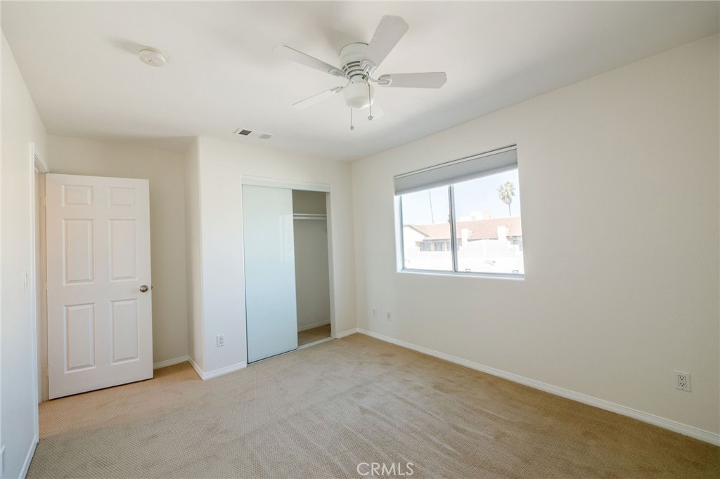 1128 Pacific Avenue Long Beach, CA 90813 - Photo 23 of 33 an empty room with fan and windows