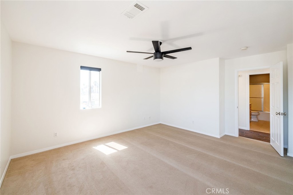 1128 Pacific Avenue Long Beach, CA 90813 - Photo 28 of 33 a view of a room with a ceiling fan and a window