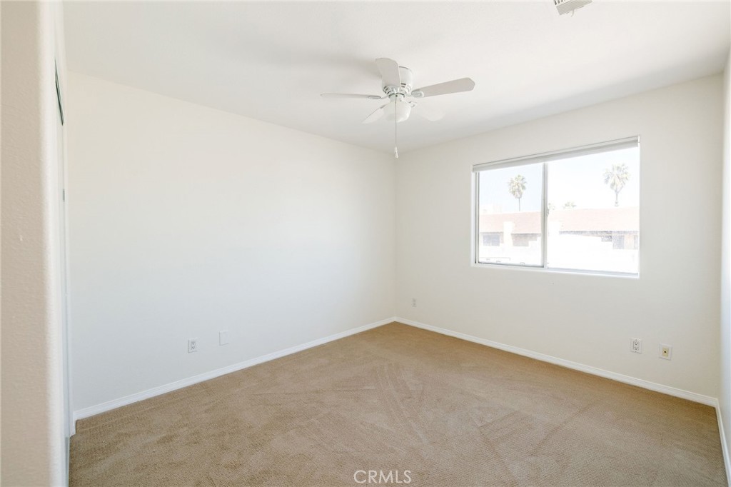 1128 Pacific Avenue Long Beach, CA 90813 - Photo 29 of 33 an empty room with a window and a fan