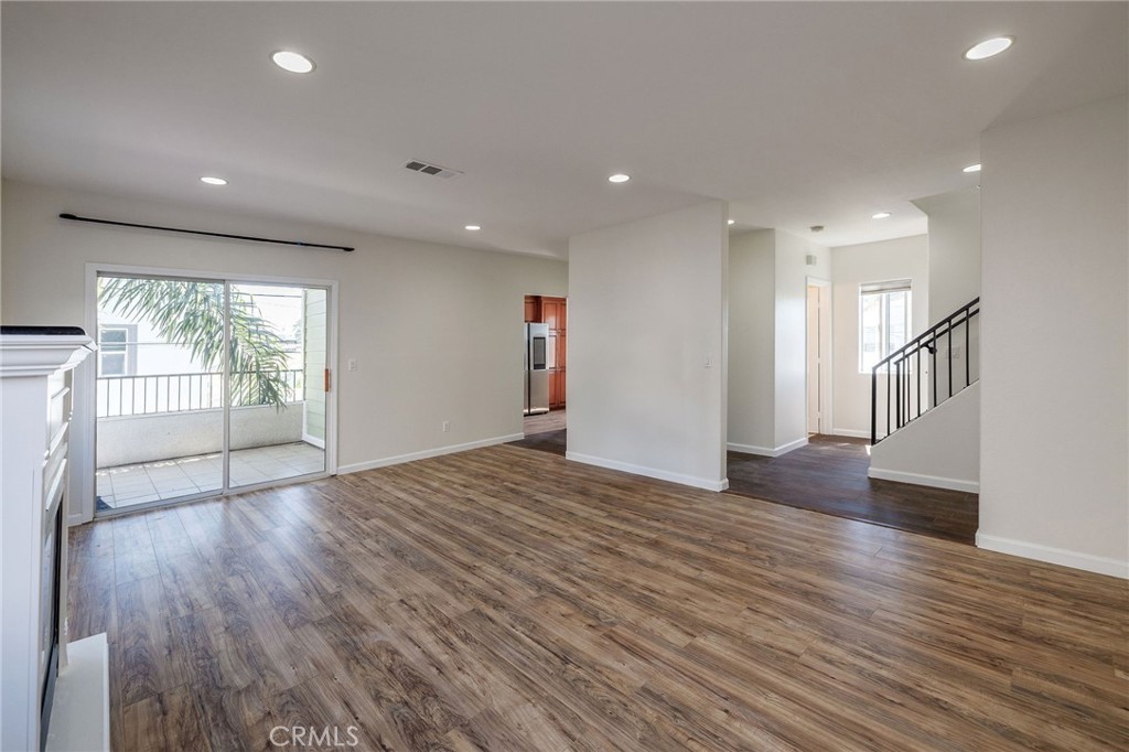 1128 Pacific Avenue Long Beach, CA 90813 - Photo 8 of 33 a view of empty room with wooden floor and fan