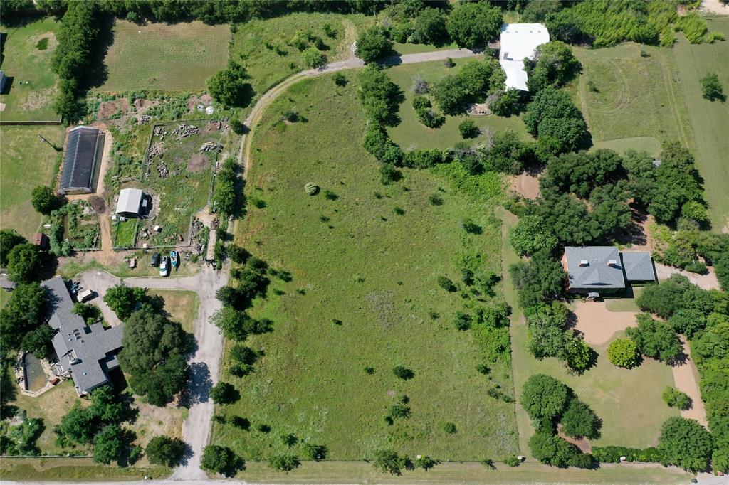 6767 Silver Saddle Road Fort Worth, TX 76126 - Photo 2 of 6 an aerial view of a residential houses with outdoor space