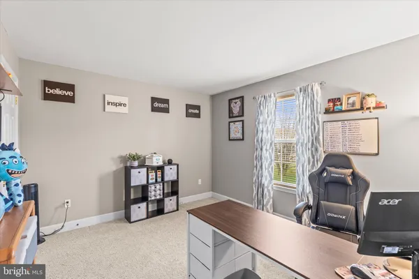 a kitchen with granite countertop a refrigerator and a stove top oven