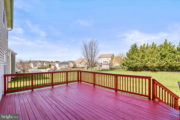 a view of a balcony with wooden floor