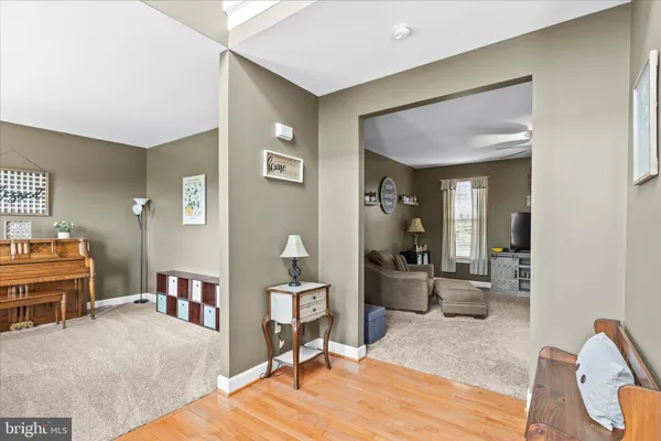 a bedroom with furniture and a wooden floor