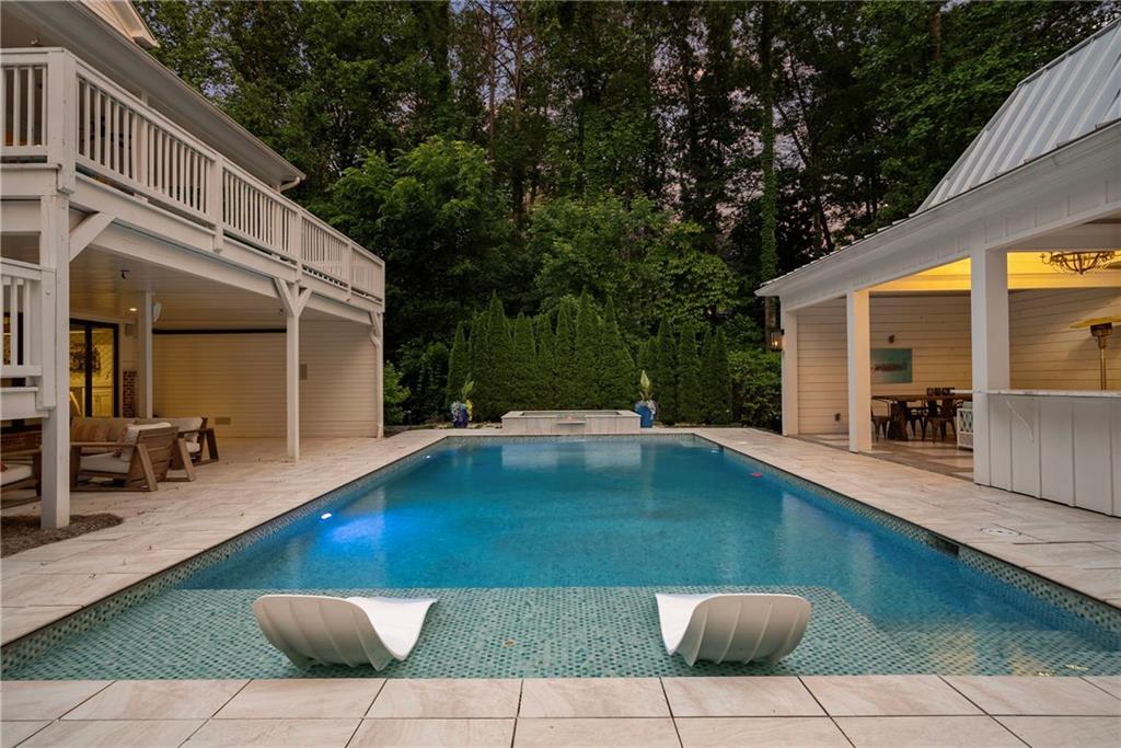 13460 New Providence Road Milton, GA 30004 - Photo 46 of 60 a view of a swimming pool with a lounge chairs