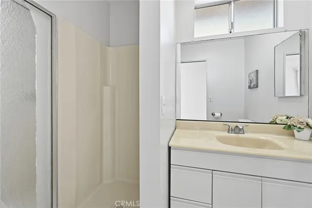 a room that has a bed and a table in it