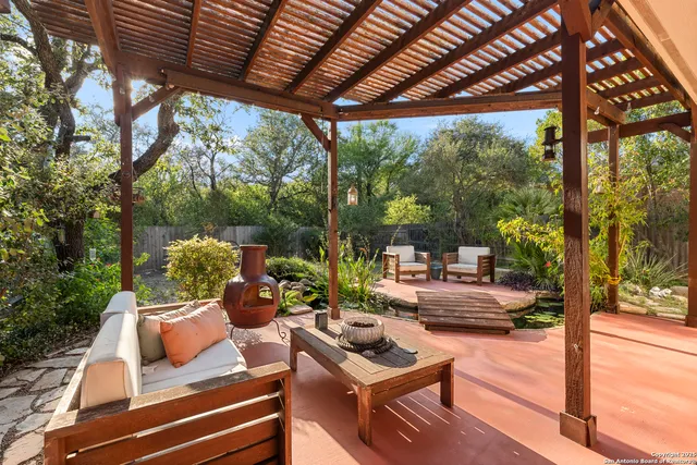 a outdoor living space with patio furniture and garden view