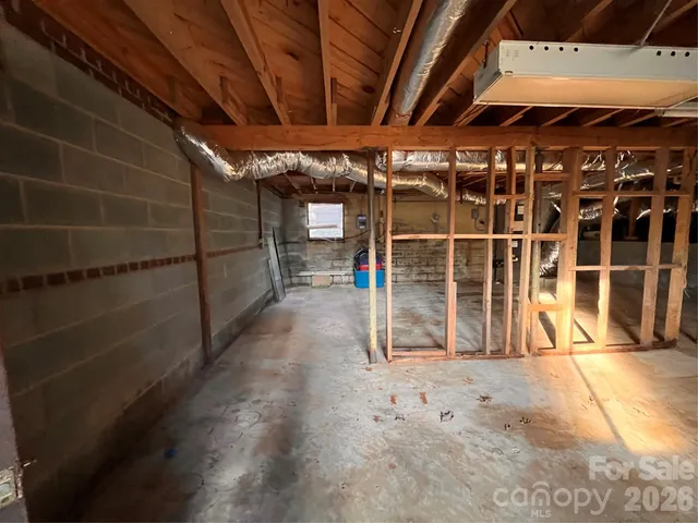a view of a backyard with large trees