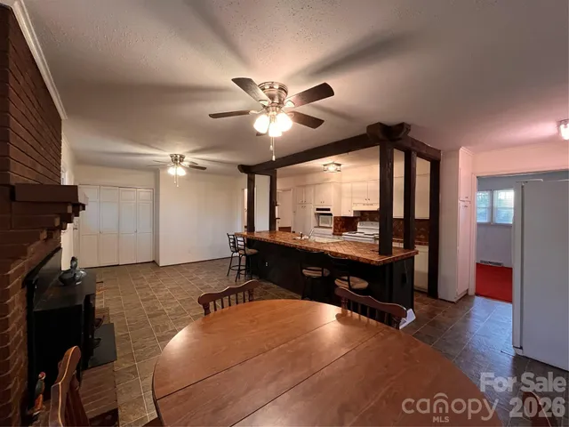 a room with furniture and a ceiling fan