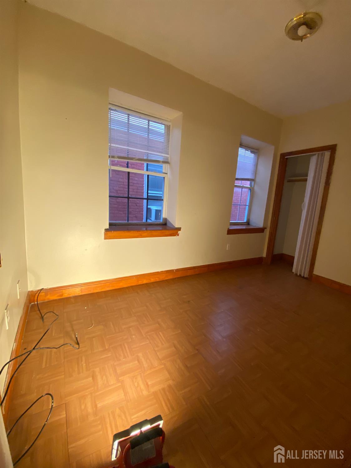 98 Catalpa Avenue, Unit 2 Perth Amboy, NJ 08861 - Photo 3 of 7 a view of an empty room with a window