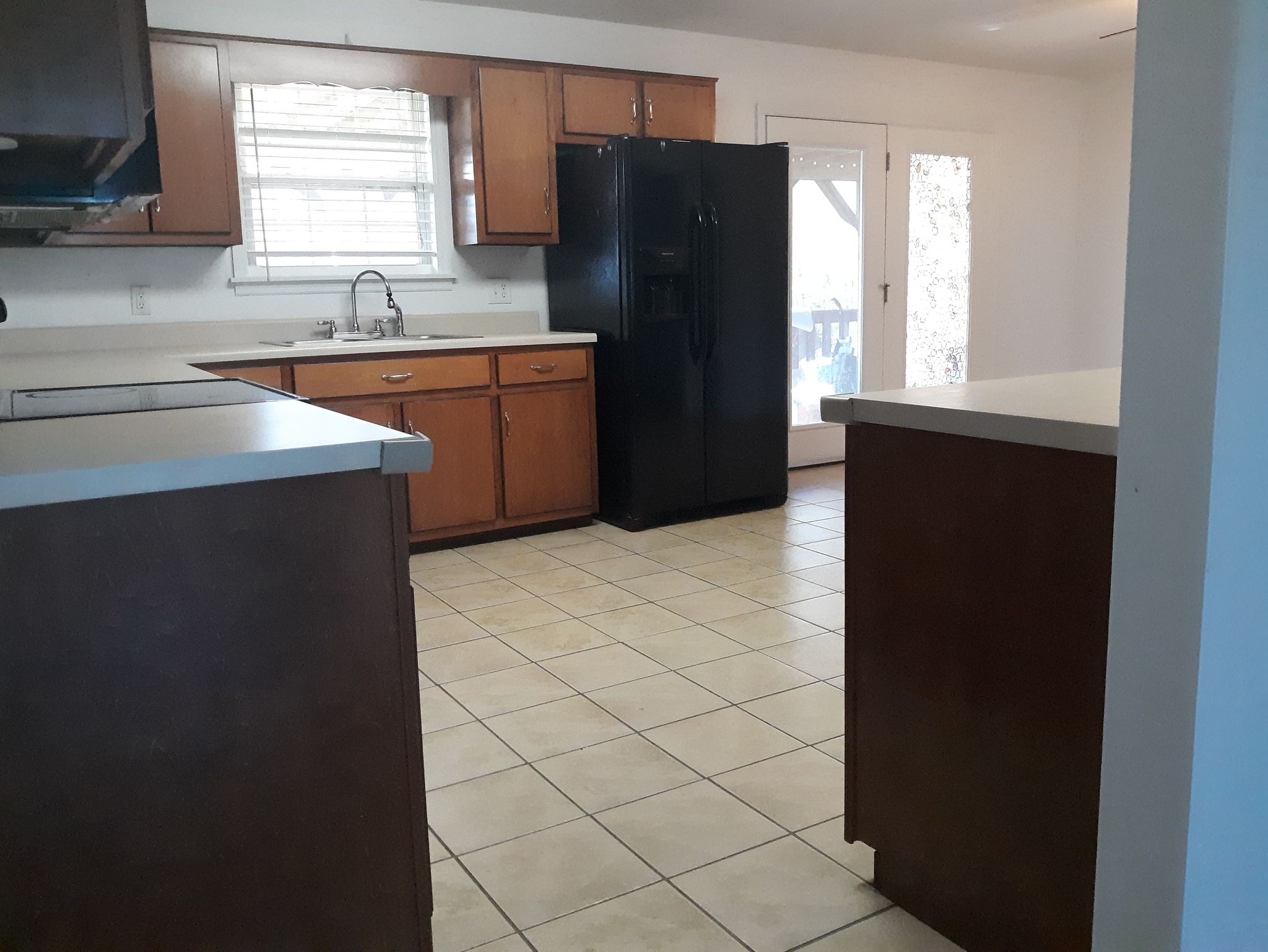 2122 Carthage Road Red Boiling Springs, TN 37150 - Photo 11 of 22 a kitchen with a refrigerator and a sink
