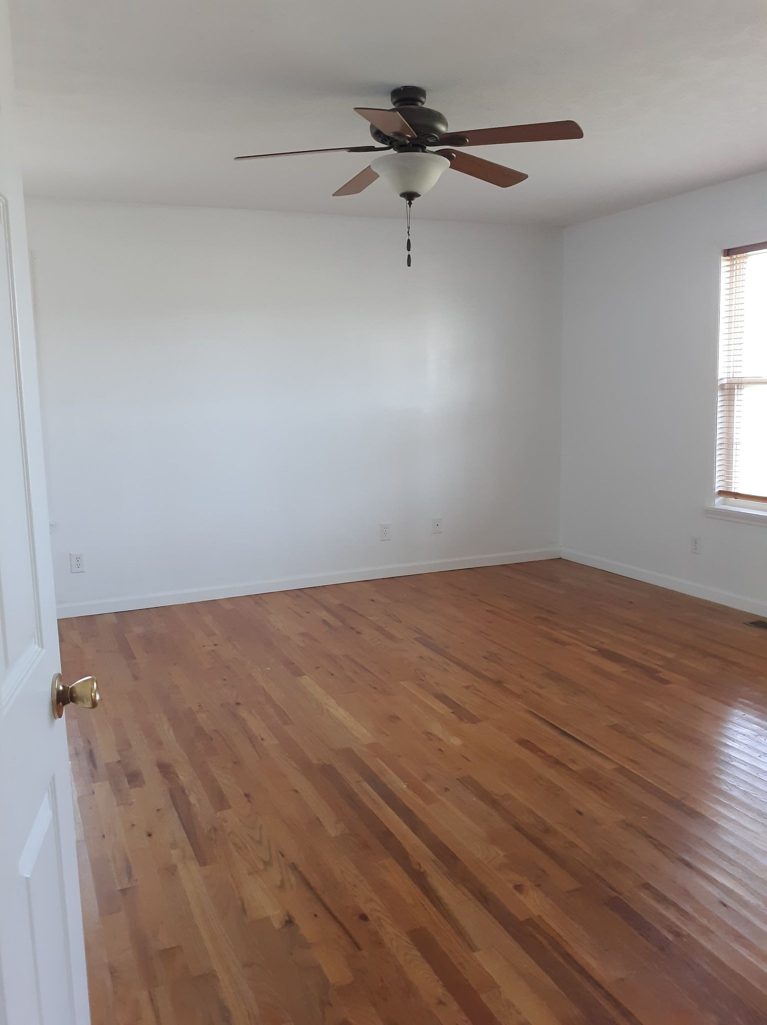 2122 Carthage Road Red Boiling Springs, TN 37150 - Photo 17 of 22 a view of a room with wooden floor and fan