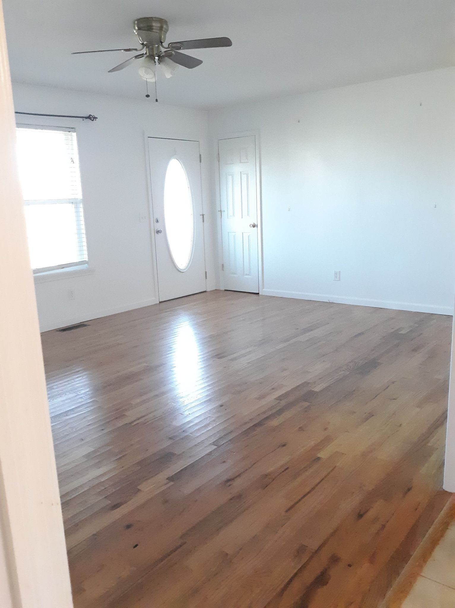 2122 Carthage Road Red Boiling Springs, TN 37150 - Photo 9 of 22 an empty room with wooden floor and windows