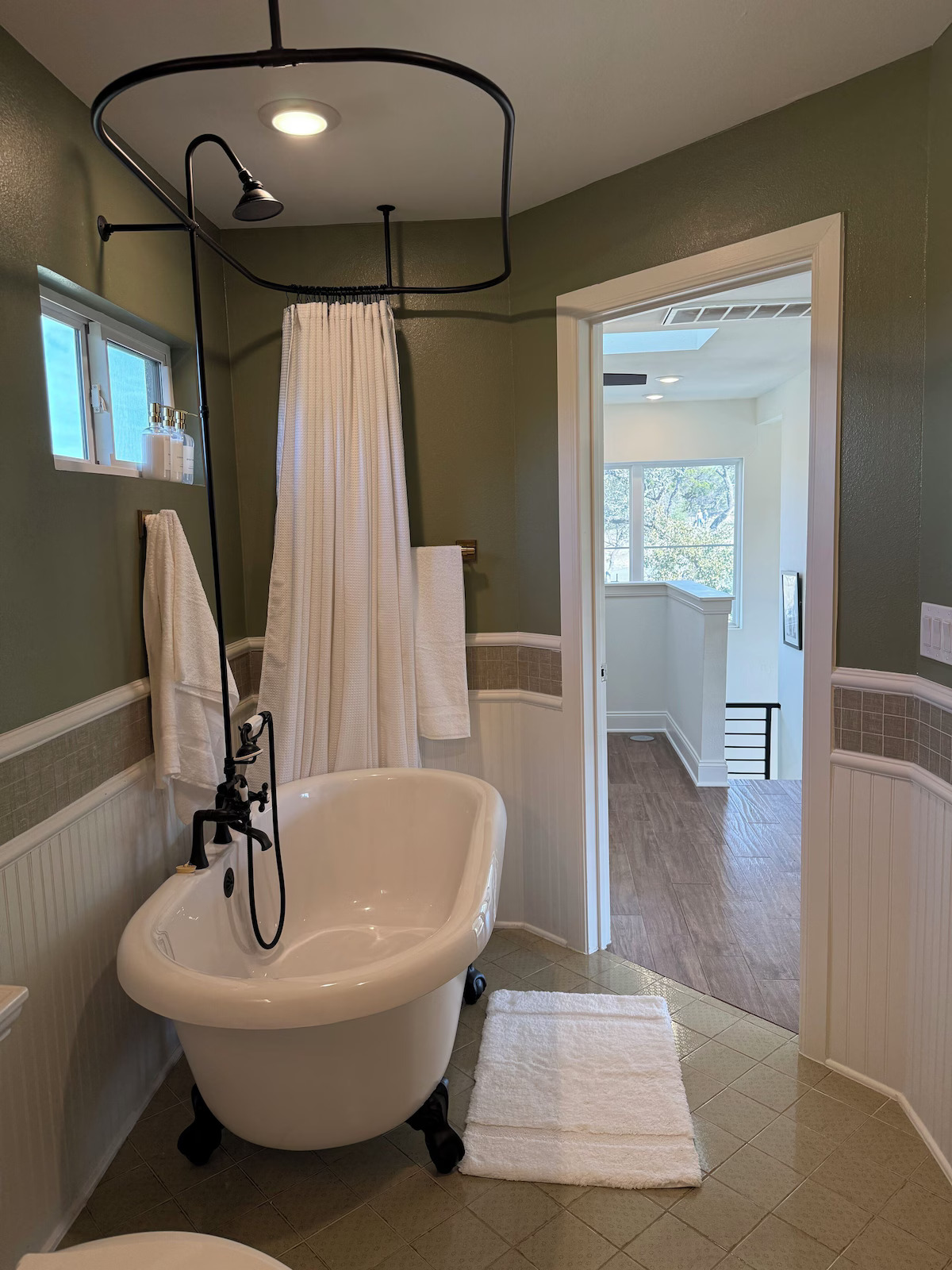 11605 Fitzhugh Road Austin, TX 78736 - Photo 14 of 24 a bathroom with a sink and a mirror