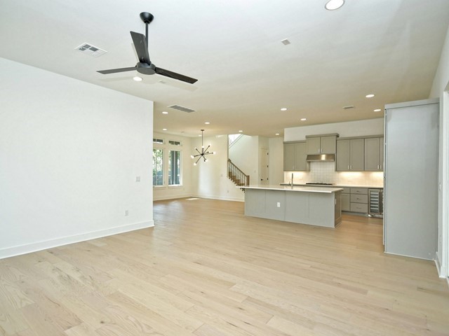 7500 St Cecelia Street Austin, TX 78757 - Photo 14 of 31 a large white kitchen with a sink stainless steel appliances and cabinets