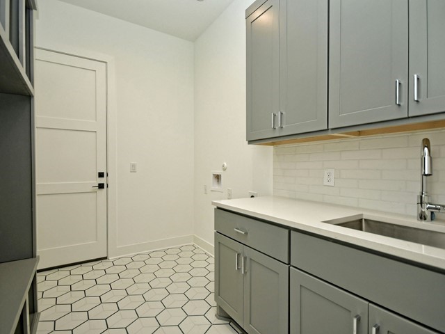 7500 St Cecelia Street Austin, TX 78757 - Photo 17 of 31 a kitchen with a sink and cabinets