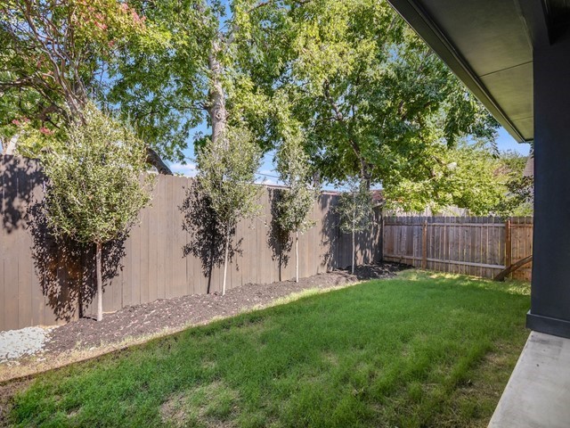 7500 St Cecelia Street Austin, TX 78757 - Photo 28 of 31 a view of a backyard with a tree