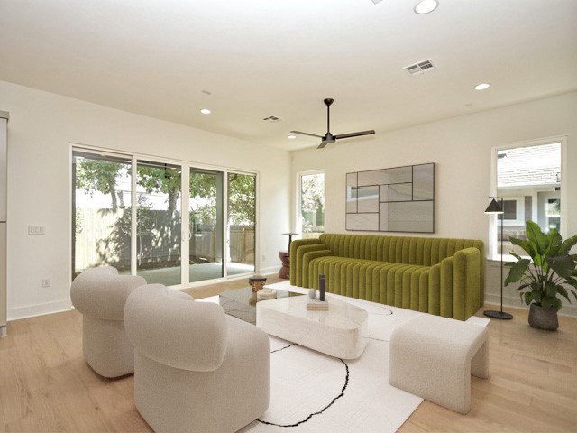 7500 St Cecelia Street Austin, TX 78757 - Photo 3 of 31 a living room with furniture and a large window