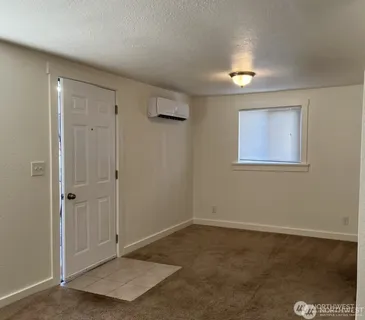 a view of an empty room with a window