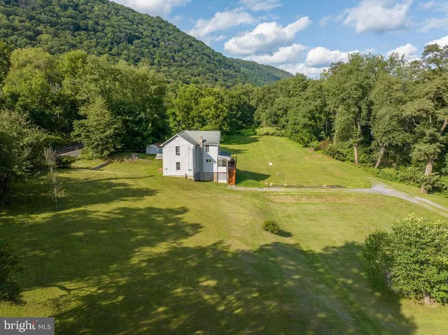 a view of a lake with a yard