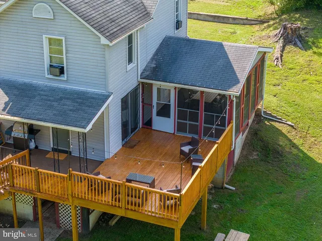 a view of a lush green forest with houses