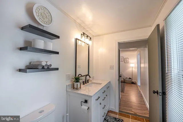 a bedroom with a bed and a chair