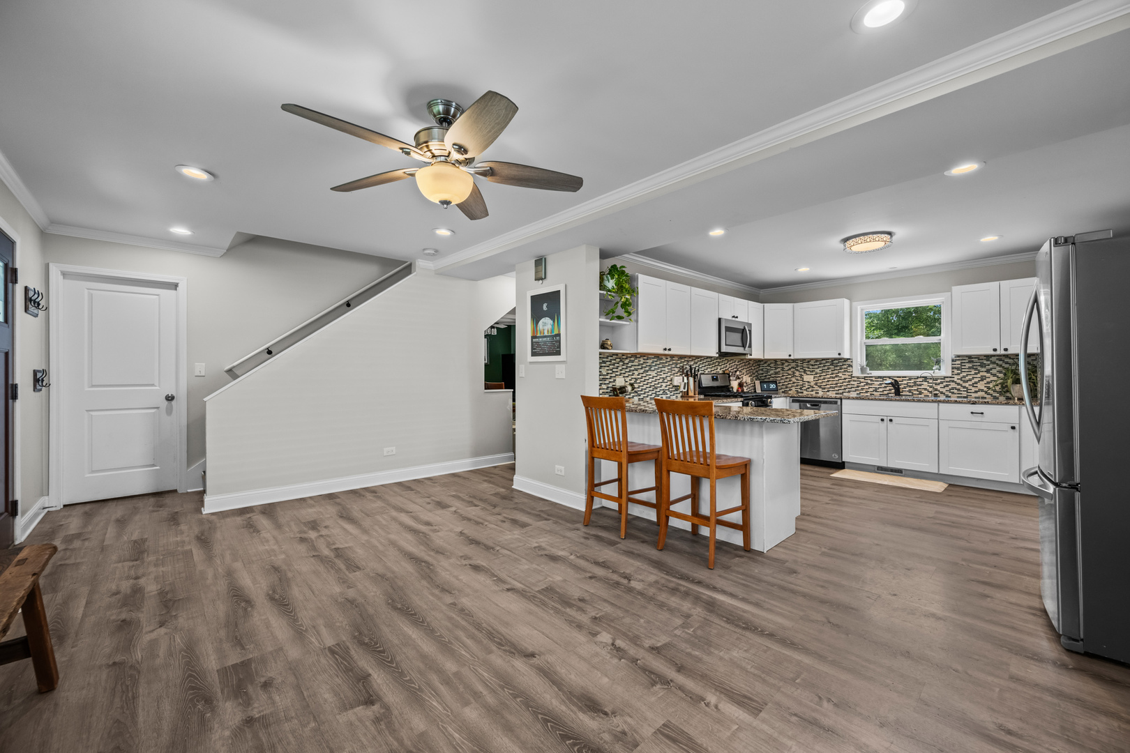 3403 Ridge Road Island Lake, IL 60042 - Photo 4 of 16 a view of kitchen with refrigerator microwave and wooden floor