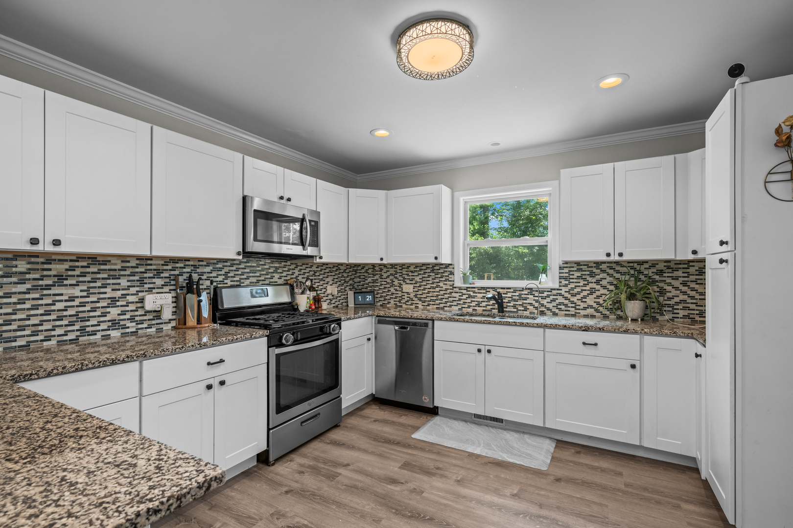 3403 Ridge Road Island Lake, IL 60042 - Photo 6 of 16 a kitchen with granite countertop white cabinets and white appliances