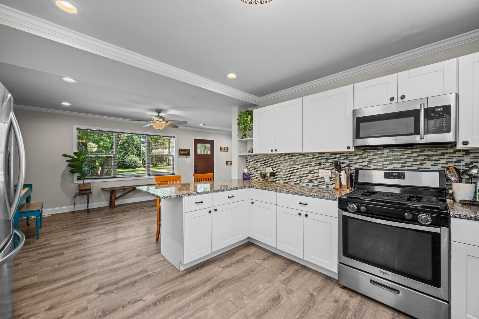 3403 Ridge Road Island Lake, IL 60042 - Photo 7 of 16 a kitchen with stainless steel appliances a stove a sink and a refrigerator