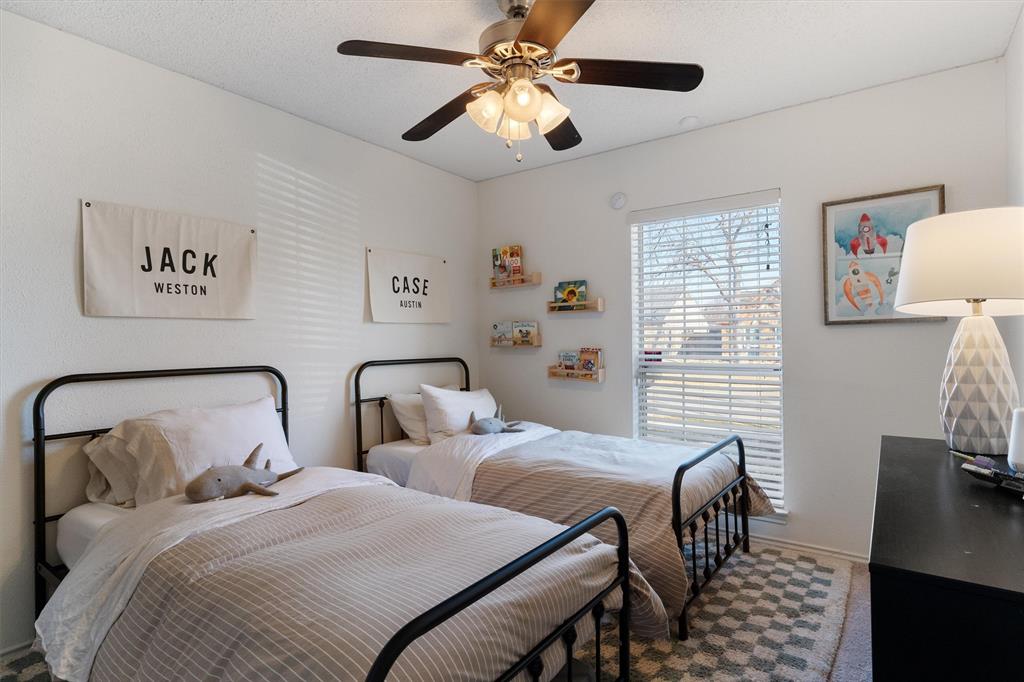 7518 Bayview Drive Rowlett, TX 75088 - Photo 18 of 22 Carpeted bedroom featuring a ceiling fan and baseboards