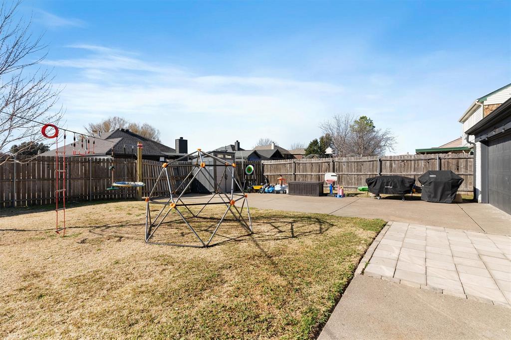 7518 Bayview Drive Rowlett, TX 75088 - Photo 21 of 22 Fenced backyard featuring a patio