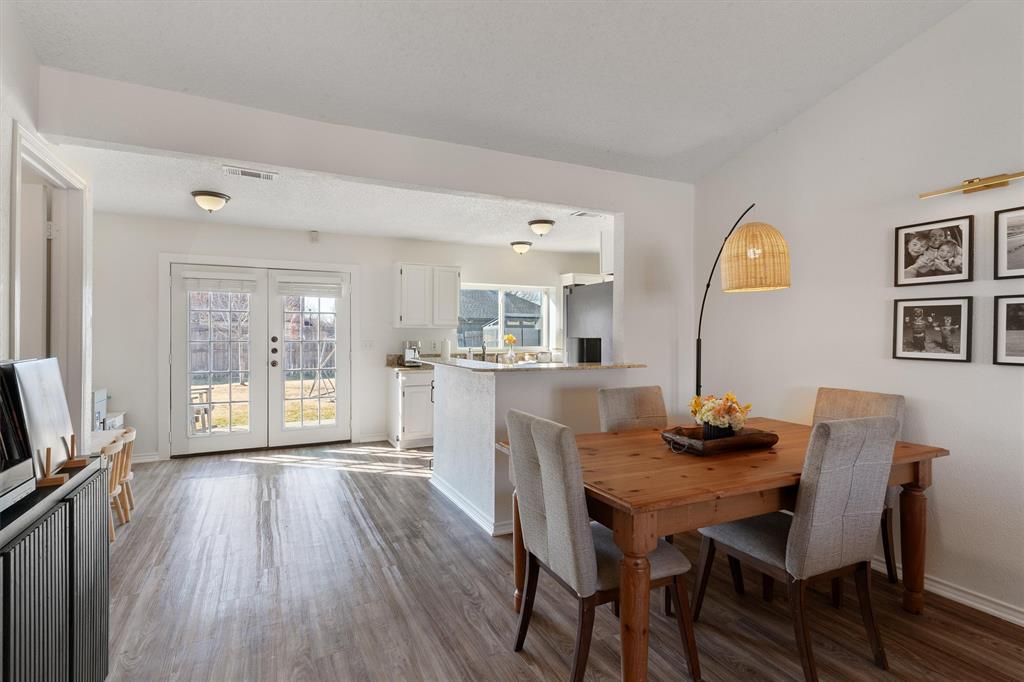 7518 Bayview Drive Rowlett, TX 75088 - Photo 7 of 22 Dining space with wood finished floors and french doors