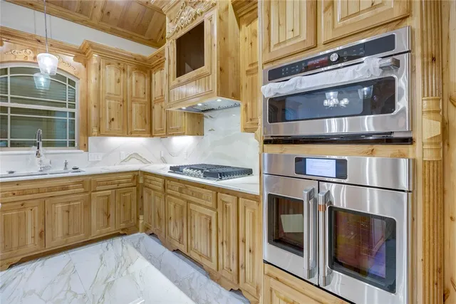 a view of a kitchen with appliances