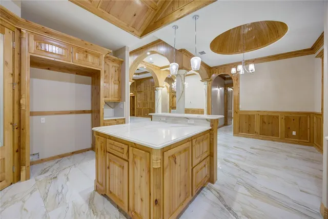 a spacious bathroom with a granite countertop sink and a mirror