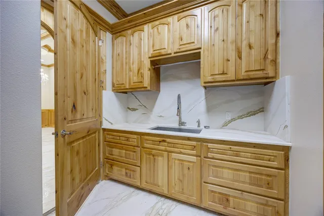 a kitchen with stainless steel appliances granite countertop a stove and a refrigerator