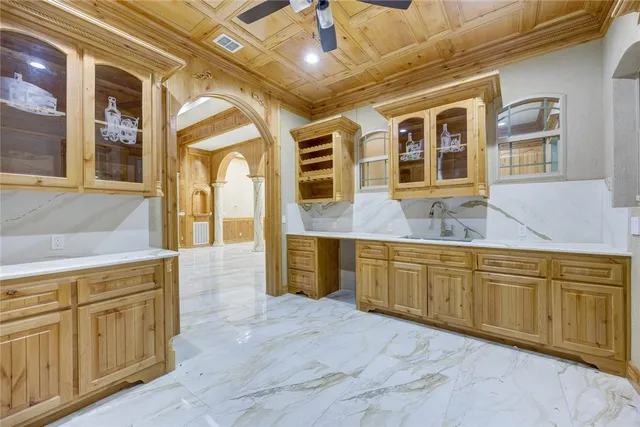 a view of an empty room with a chandelier