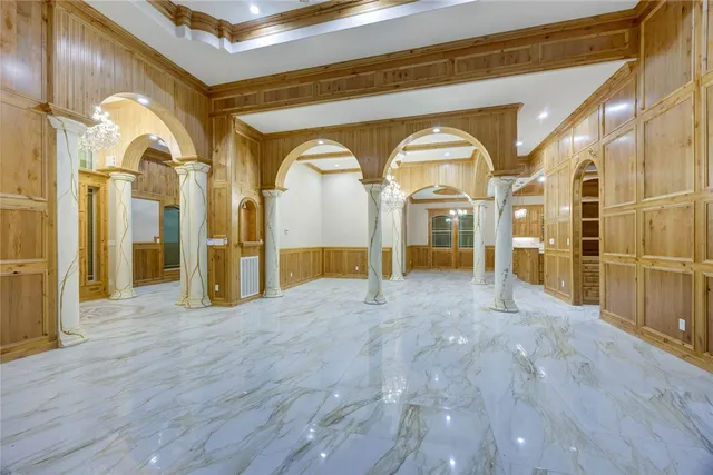 a view of a hallway with wooden floors