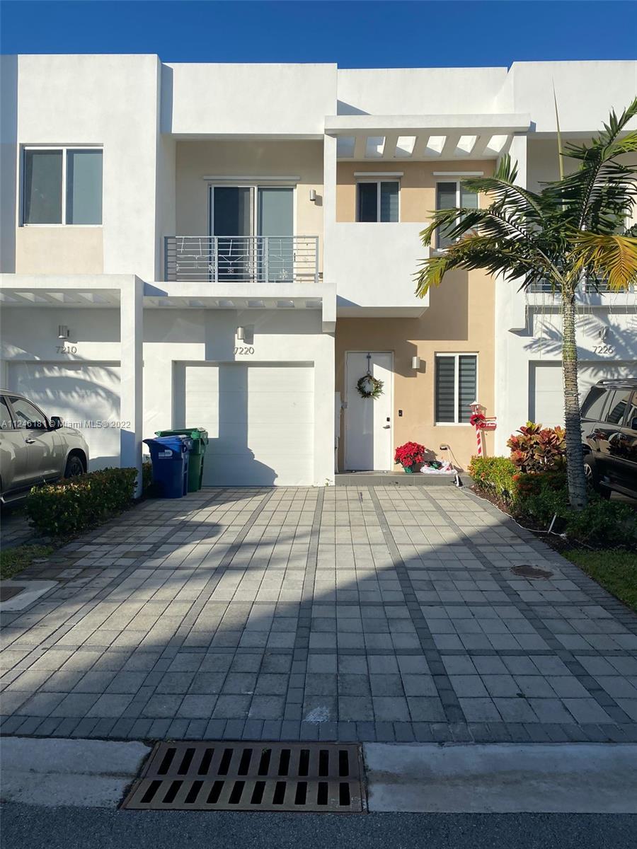 a view of a building with car parked