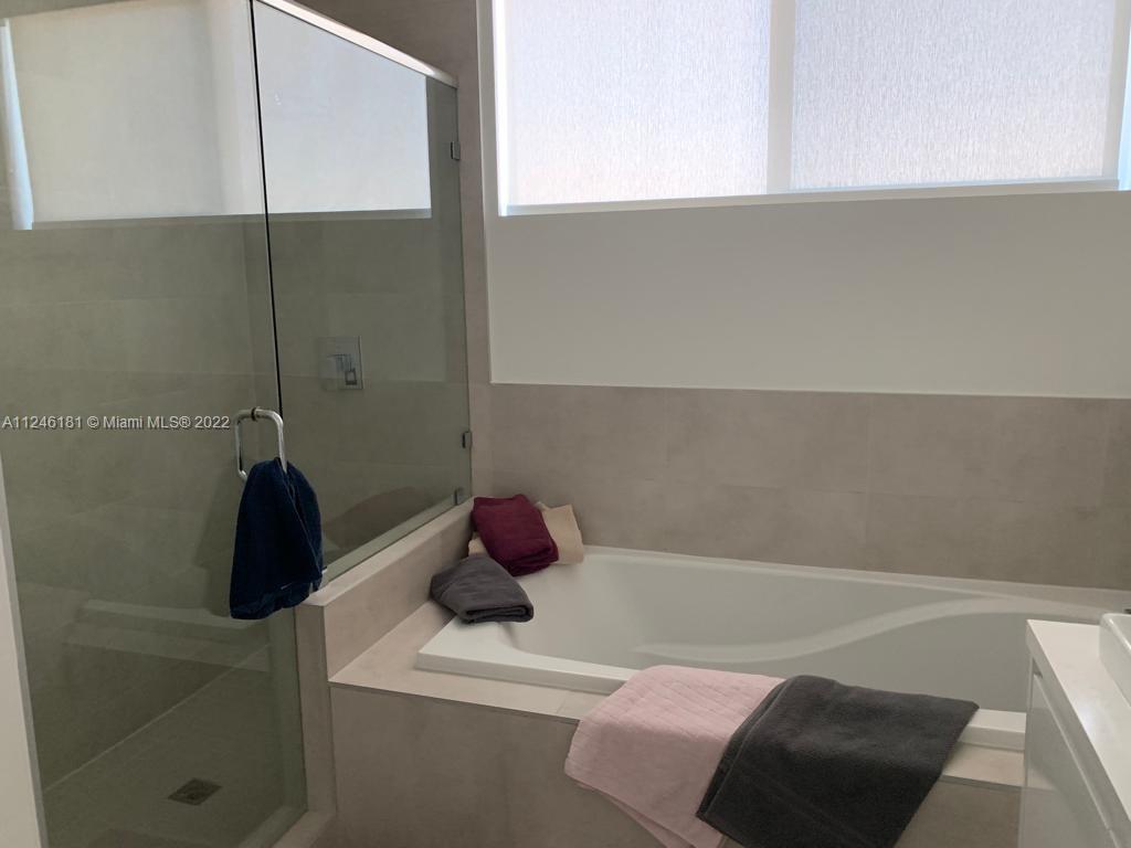 7220 Northwest 103rd Path Doral, FL 33178 - Photo 16 of 19 a bathroom with a bathtub
