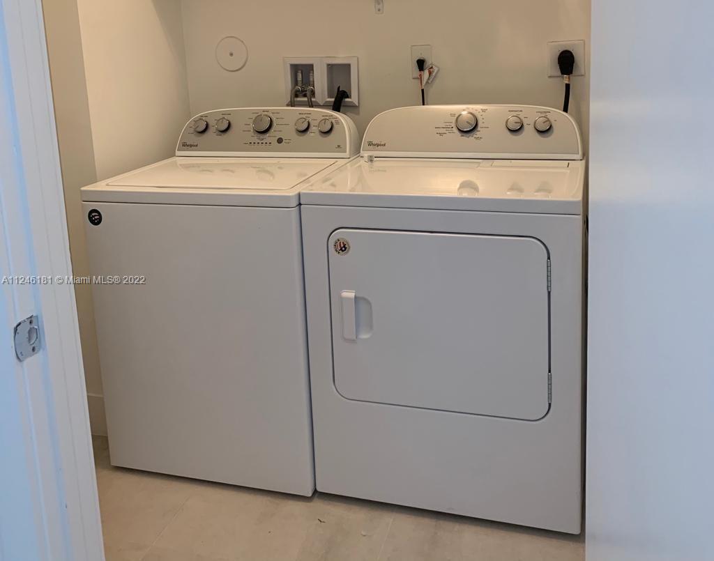 7220 Northwest 103rd Path Doral, FL 33178 - Photo 17 of 19 a utility room with dryer and washer