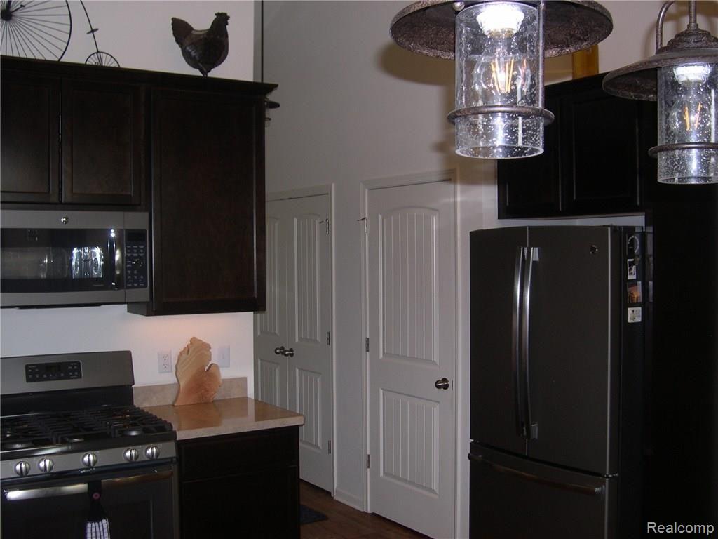 4170 Elevation Lane Howell, MI 48855 - Photo 10 of 36 NEWER KITCHEN APPLIANCES STAY