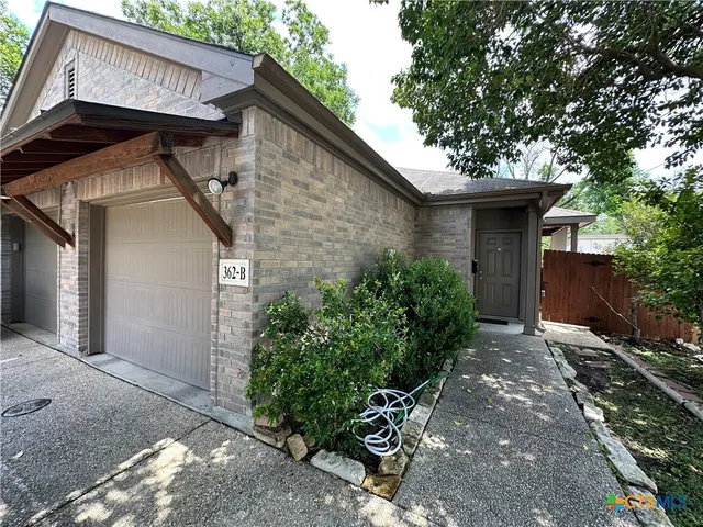 a house with trees in the background
