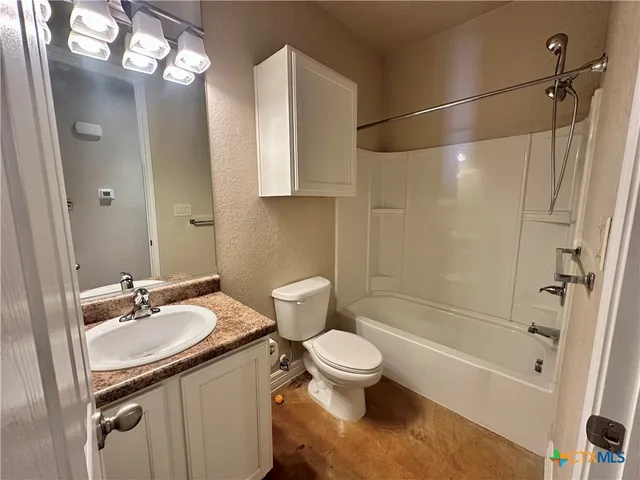 a view of a backyard with wooden fence