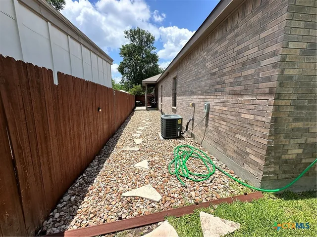 a backyard of a house with outdoor seating