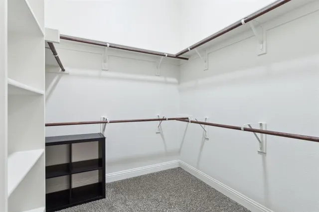 a bathroom with a granite countertop sink mirror shower and bathtub