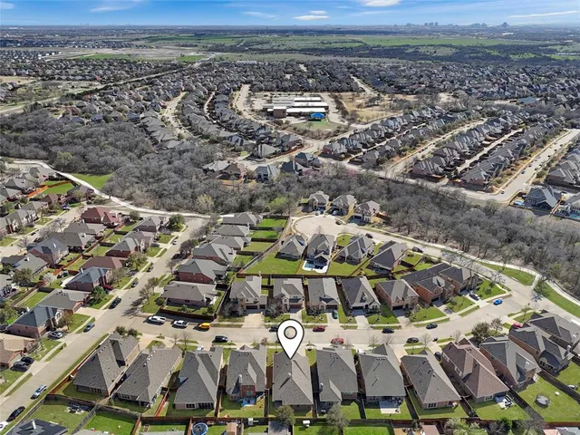an aerial view of a building with parking space