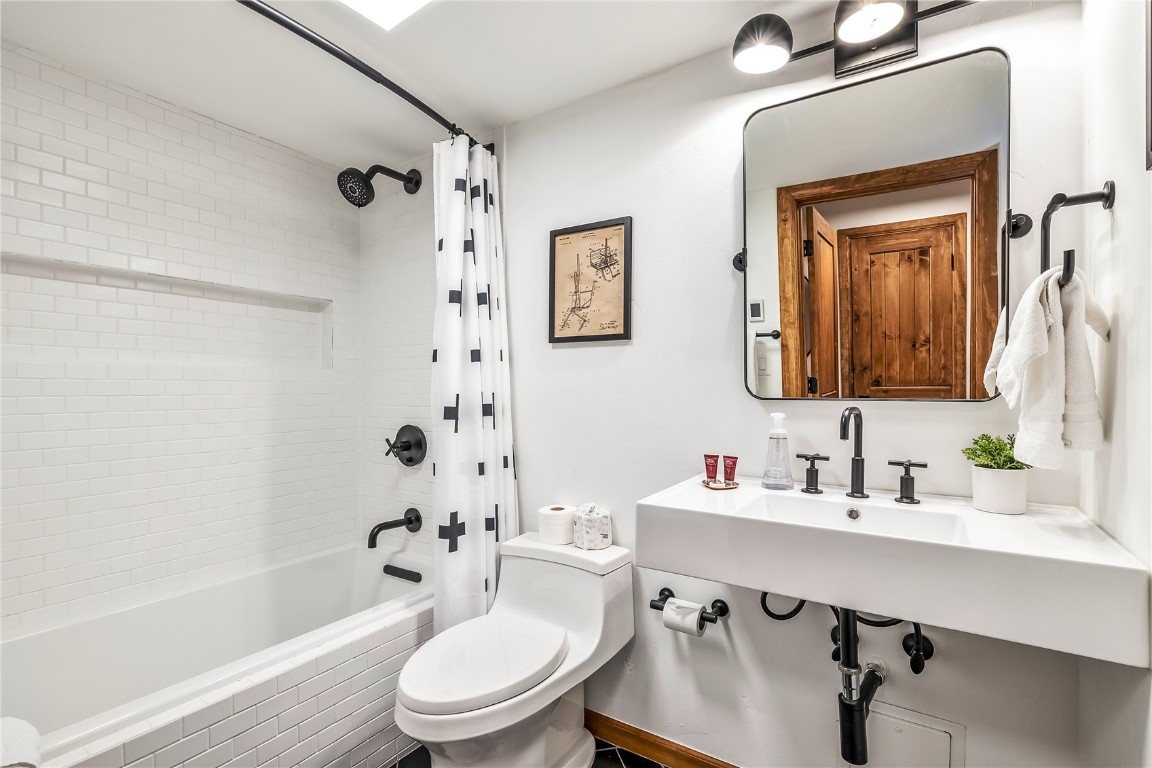 800 Columbine Road, Unit 5 Breckenridge, CO 80424 - Photo 29 of 38 a bathroom with a sink a toilet and shower