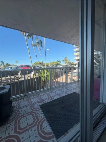 a view of a street with chairs